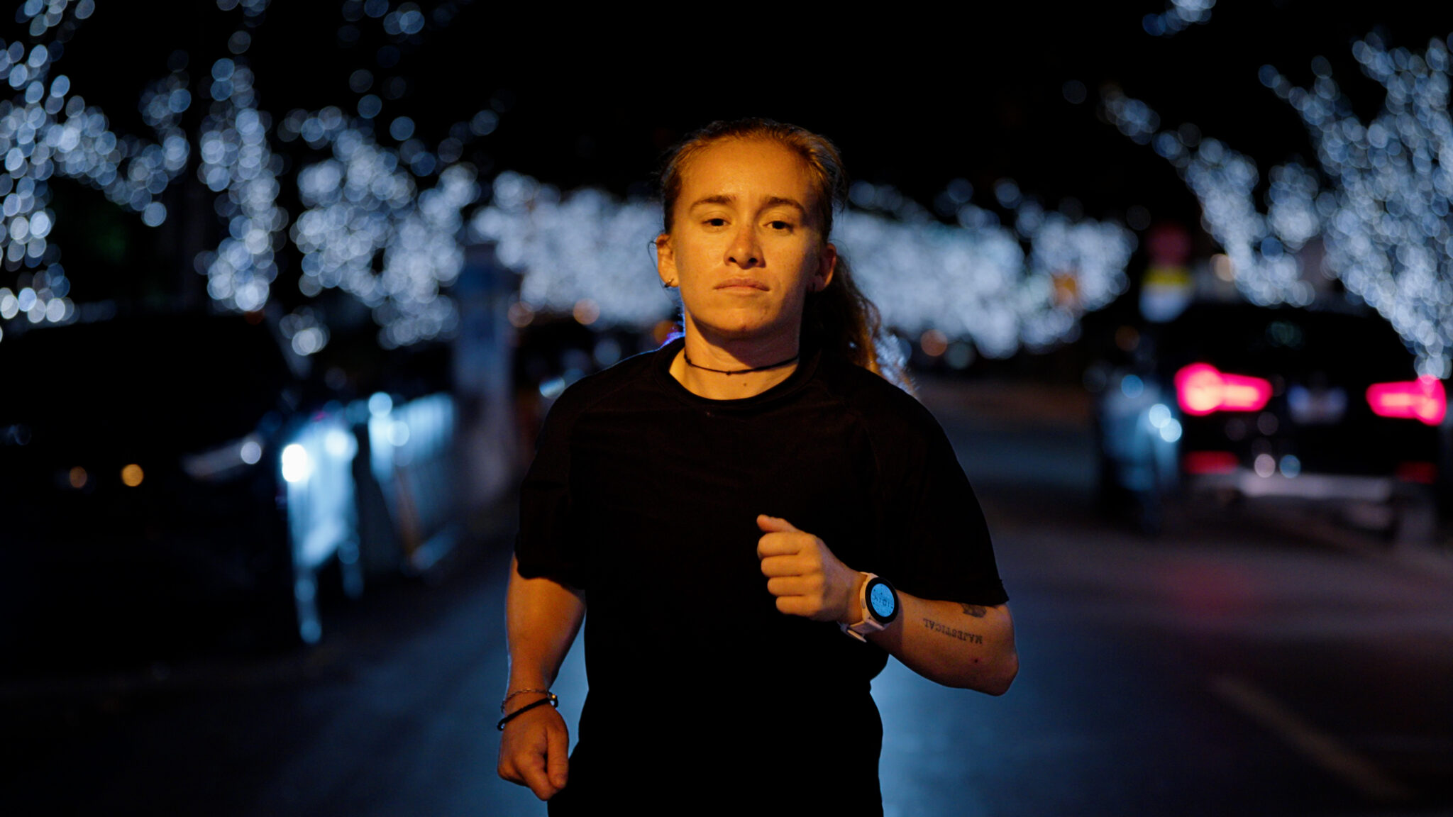 Sandra Alonso running at night in Miami Beach